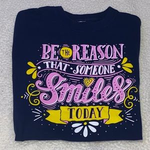 Shirt colors pink and yellow and a really deep blue with quote